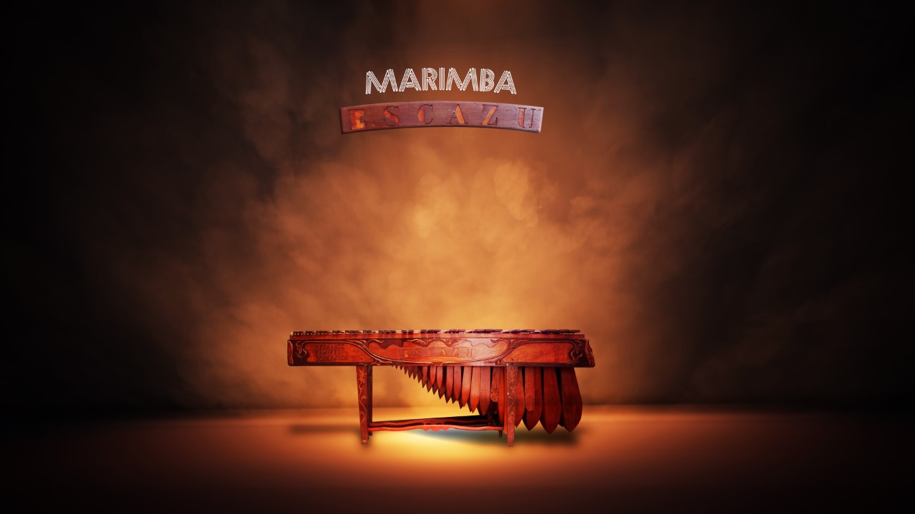 Marimba Escazú iluminada en un escenario cálido